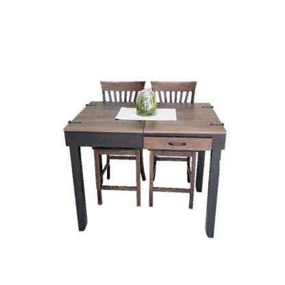 A wooden jigsaw puzzle table with a dark brown top and black legs, accompanied by two matching wooden chairs. A small glass jar sits on a white placemat on the table.