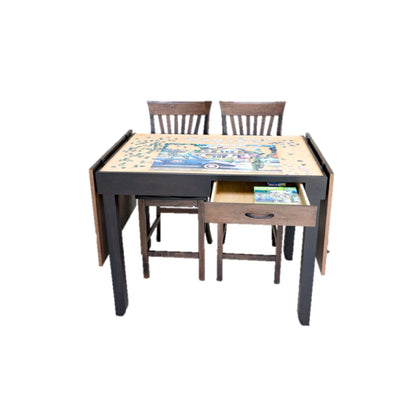 counter hight jigsaw puzzle table with chairs with a jigsaw puzzle on the recessed area of the open table and a drawer on a white background