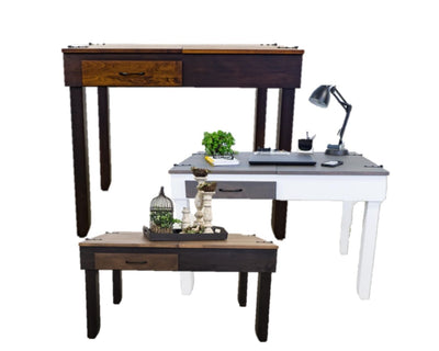 A set of three wooden jigsaw puzzle tables in different heights and styles, shown on a plain white background. The tables feature a mix of dark brown, medium brown, and light wood tones, with one white desk and one dark brown desk.