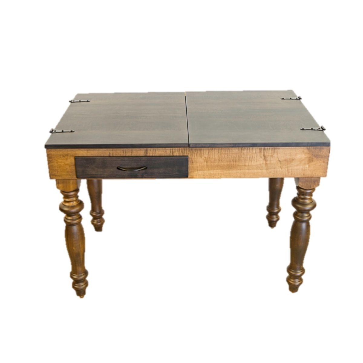 A wooden jigsaw puzzle table with a dark brown top, a single drawer with a dark metal pull, and turned legs, shown on a plain white background.