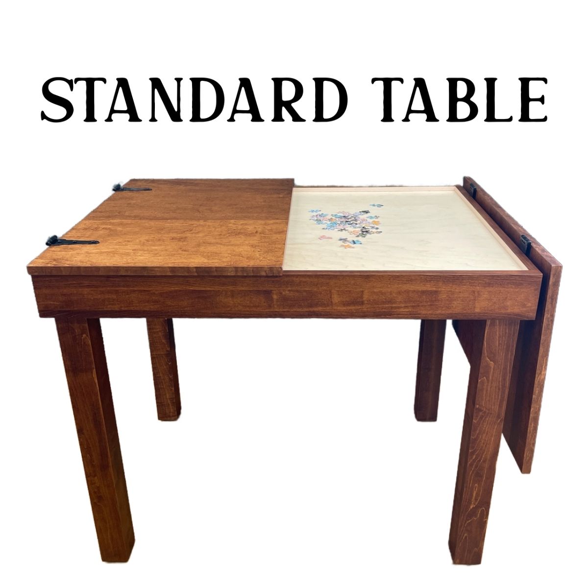 A wooden jigsaw puzzle table shown on a white background with the text 'STANDARD TABLE' above it. The table has a medium brown wood finish on most surfaces and a light natural wood playing surface with jigsaw puzzle pieces on the recessed playing area.